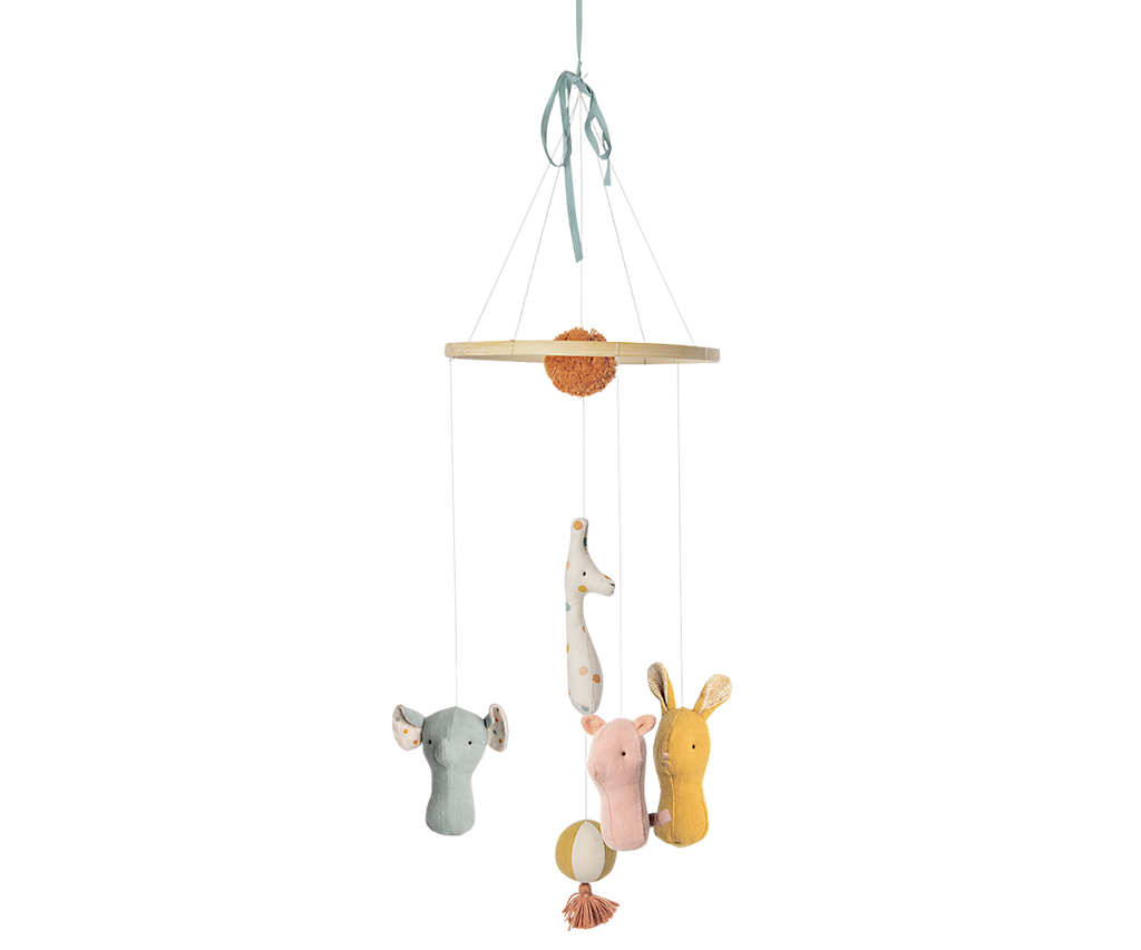 Children's mobile with hanging animal figures on a white background