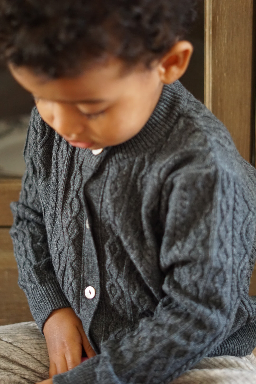 La Petit Lapin Cashmere & Merino Wool Cable Knit Cardigan | Dark Gray Melange | Playroom Avenue