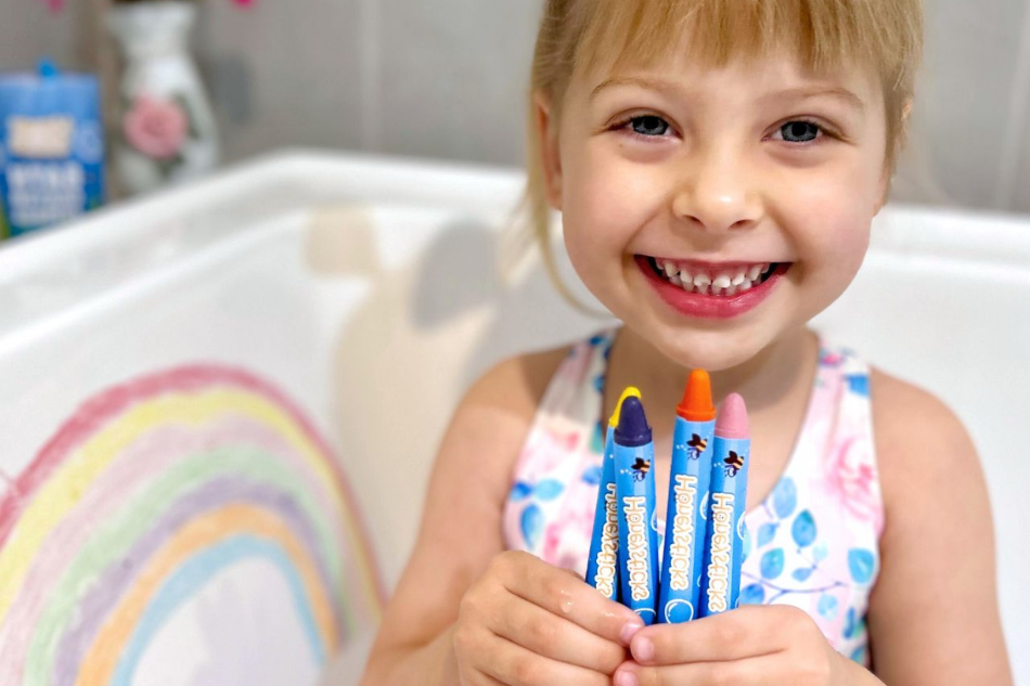 Child playing with Honeysticks Bath Crayon Jumbos - Safe Non-Toxic Bath Crayons for Kids | Playroom Avenue