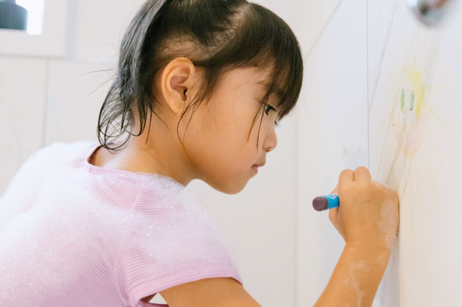 Child drawing with Honeysticks Bath Crayon Jumbos - Safe Non-Toxic Bath Crayons for Kids | Playroom Avenue