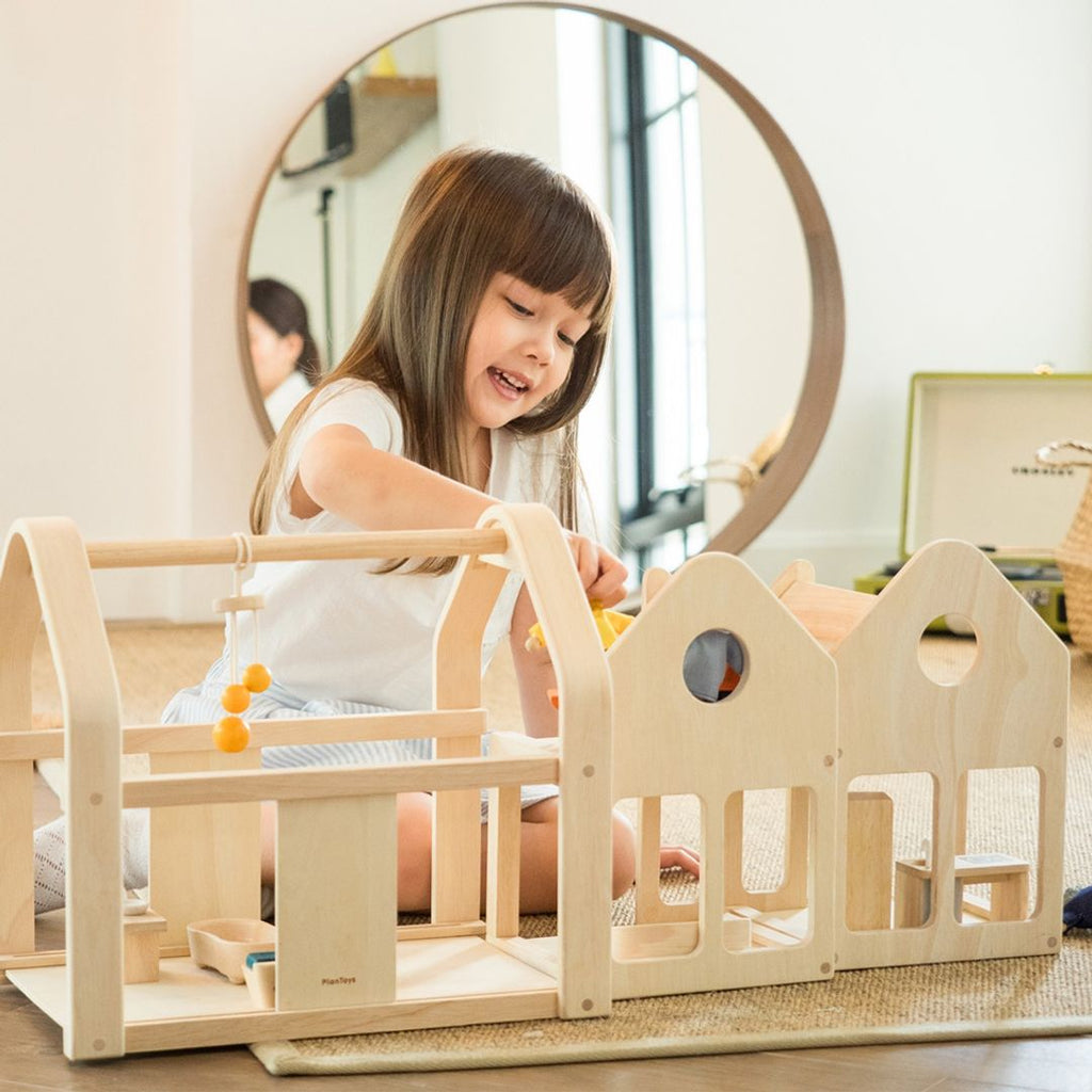 PlanToys Slide N Go Dollhouse | Playroom Avenue