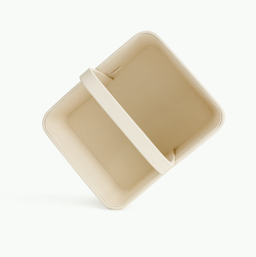 Beige rectangular Gathre Caddy container with a handle on a white background