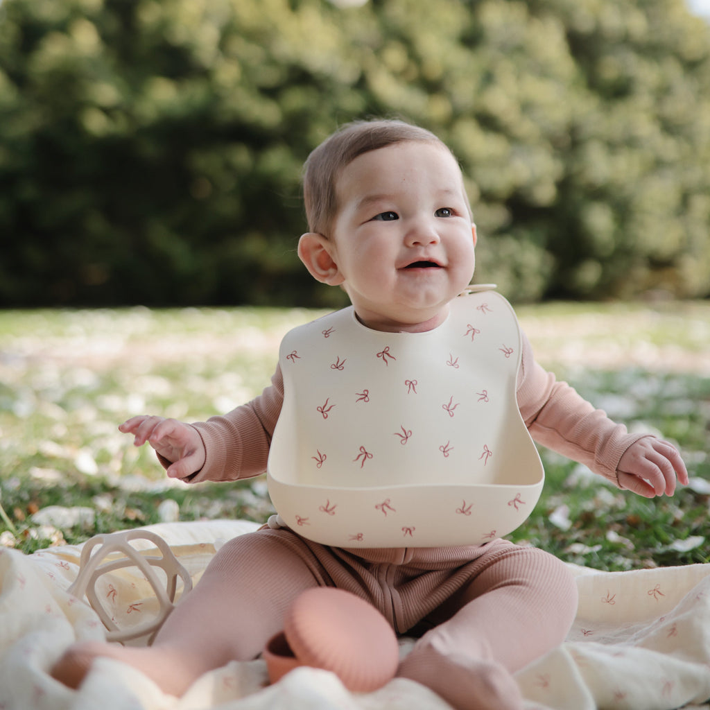 Mushie Silicone Baby Bib | Playroom Avenue