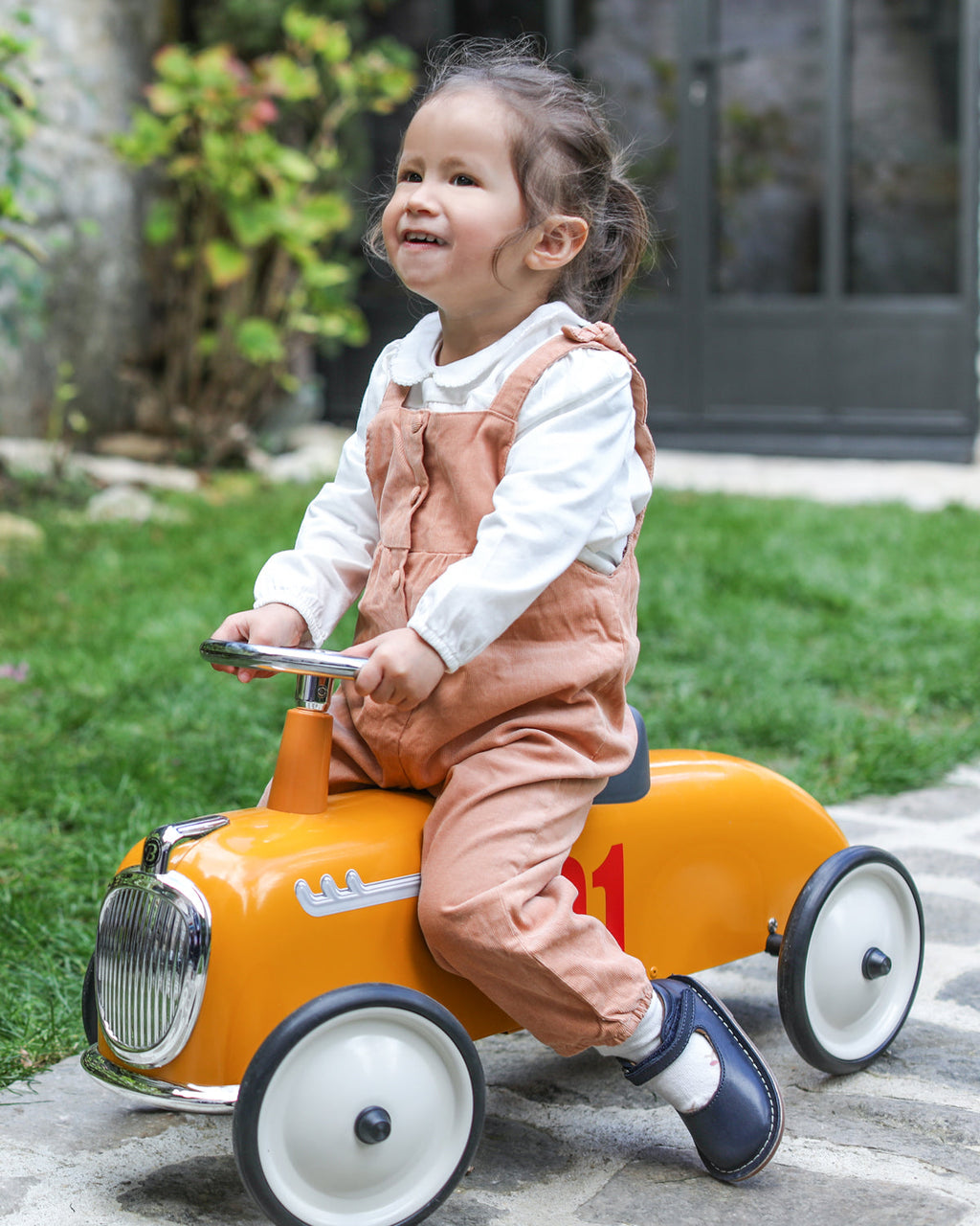 Yellow baghera ride-on roadster with the number 01 on a white background