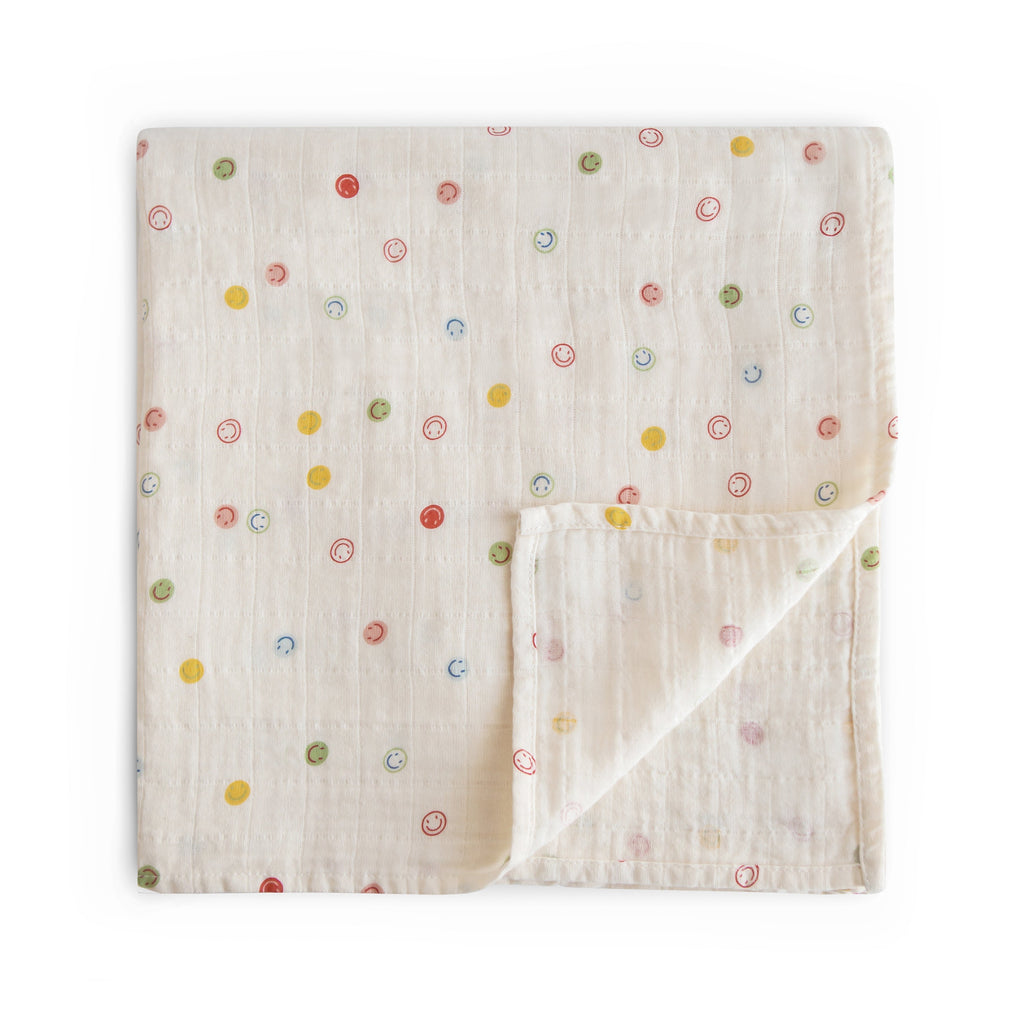 Mushie Organic Cotton Muslin Swaddle Blanket Smiley Face | Playroom Avenue