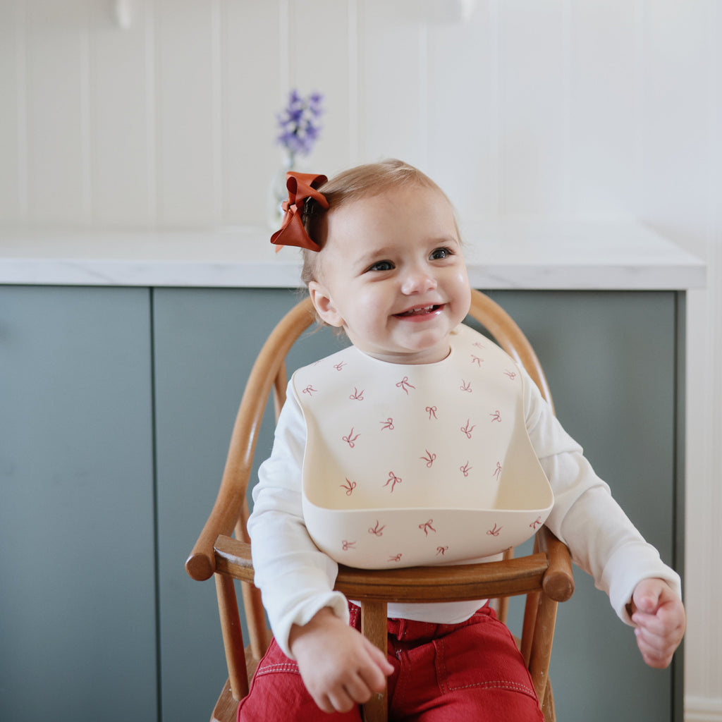 Mushie Silicone Baby Bib | Playroom Avenue