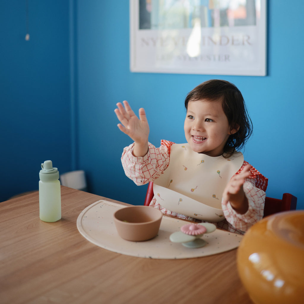 Mushie Silicone Baby Bib | Playroom Avenue