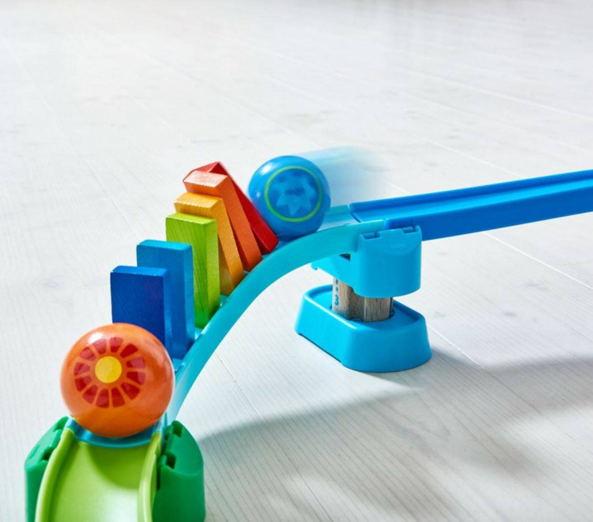 Haba colorful kullerbu toy track with moving balls on a light gray background