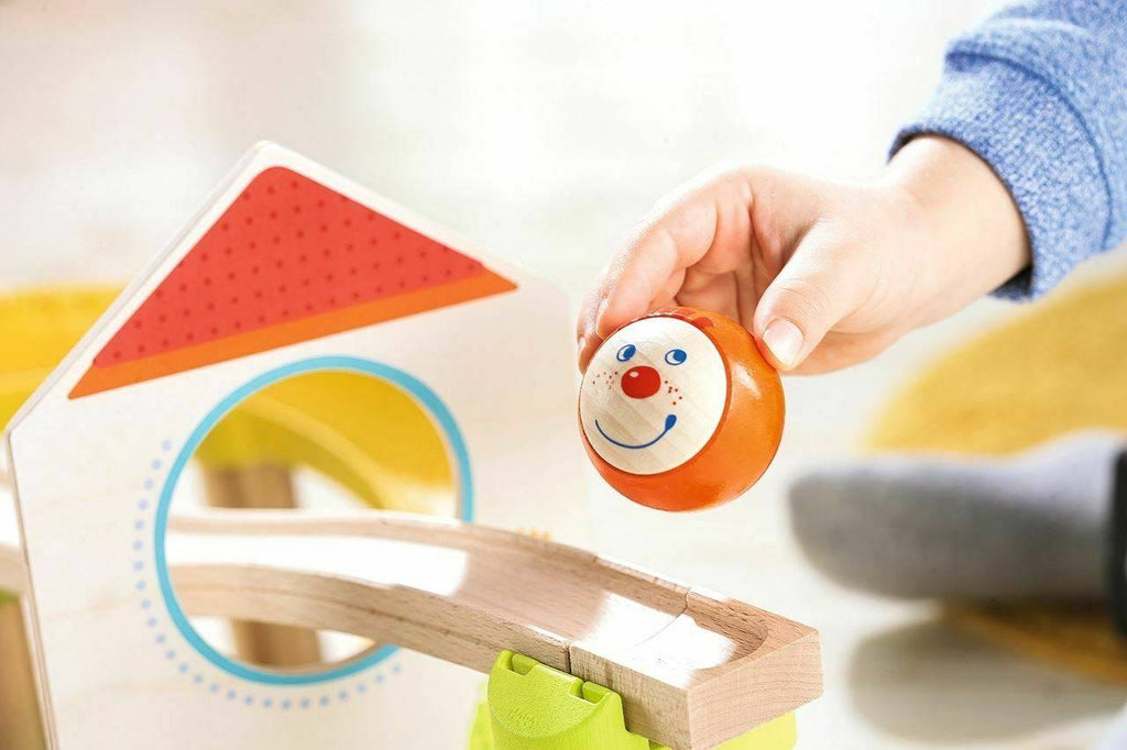 Child playing with HABA Kullerbu Windmill 25 Piece Starter Track Set - Ball Track System