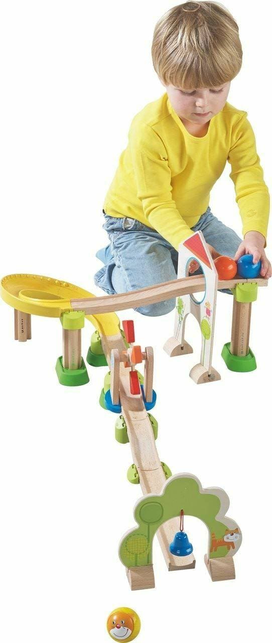 Child playing with HABA Kullerbu Windmill 25 Piece Starter Track Set - Ball Track System