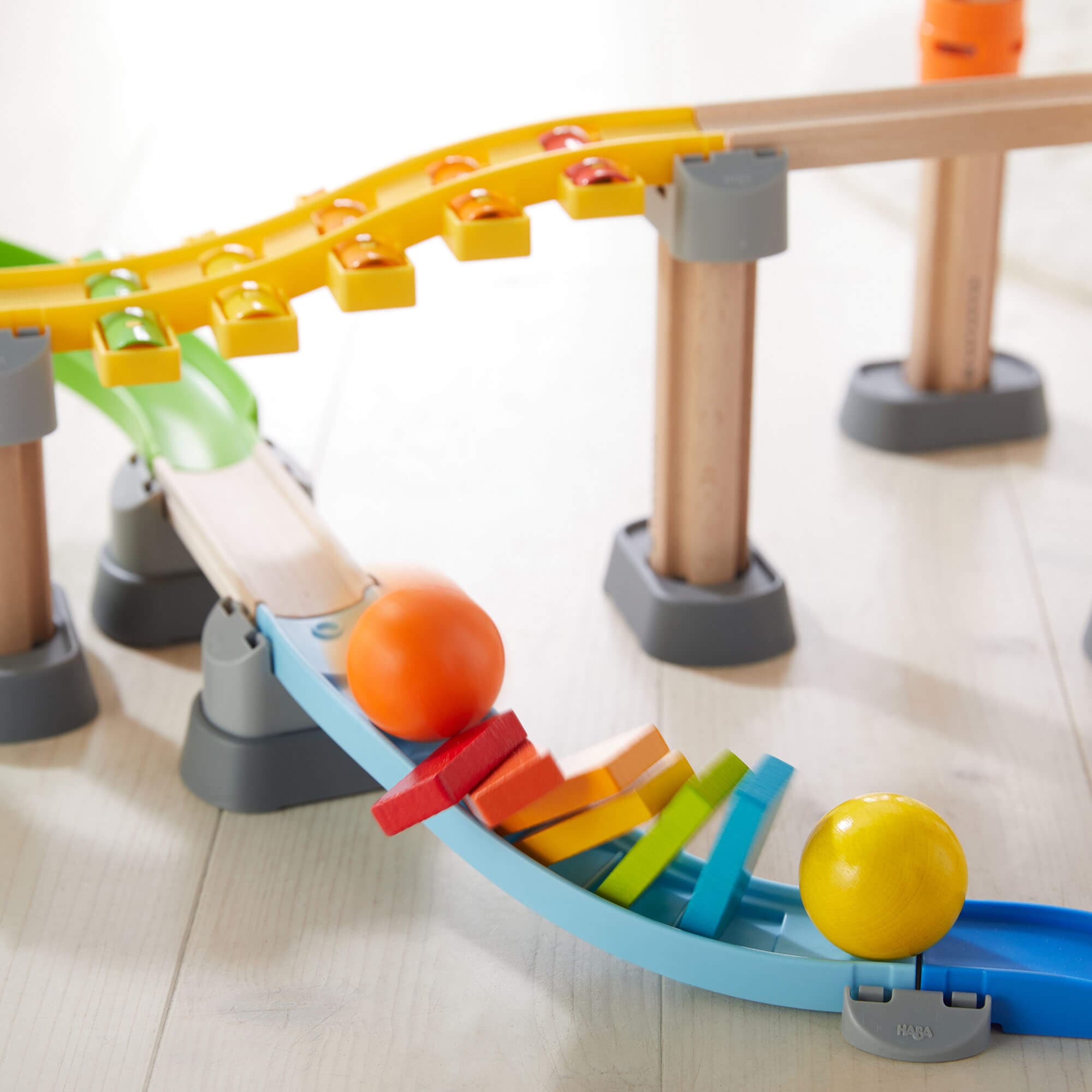 Close up of elements from the HABA Kullerbu Melody Dominoes Set - Musical Ball Track System | HABA USA