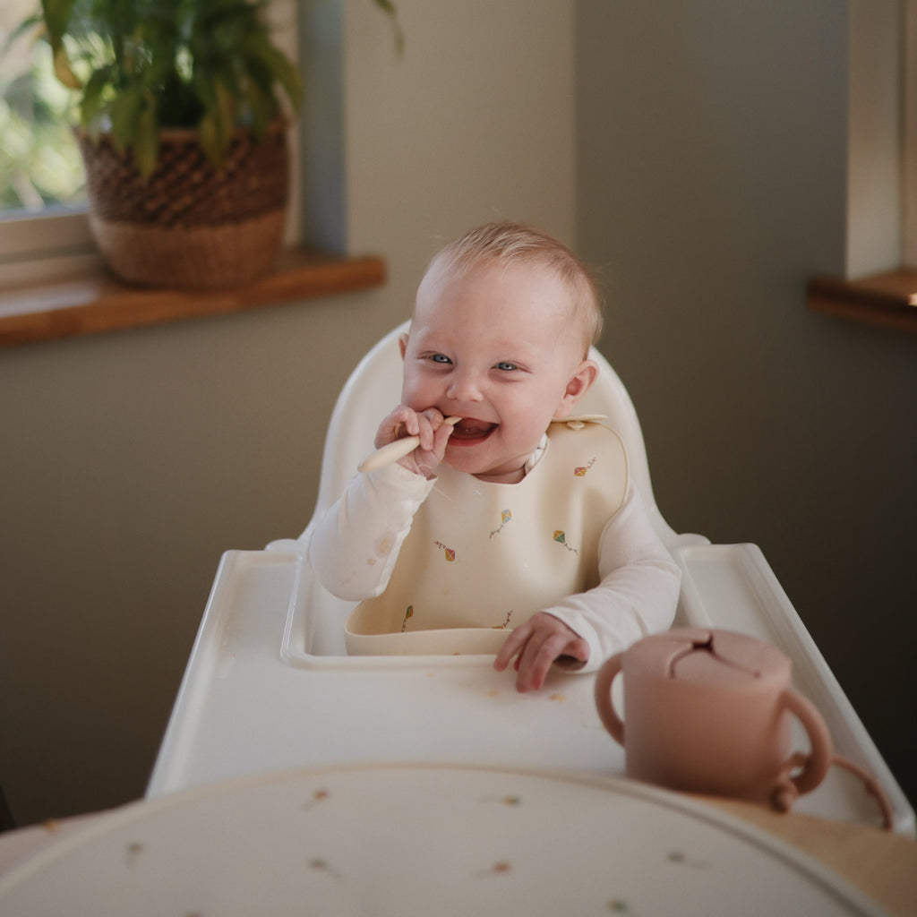 Mushie Silicone Baby Bib | Playroom Avenue